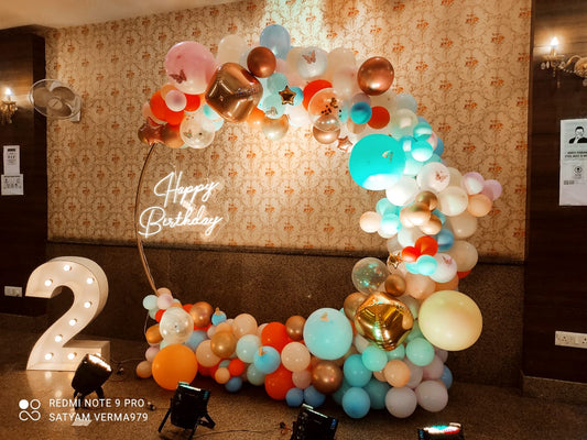 Colorful Balloons Arch Decoration With Golden, Yellow, Orange, Brown ,Blue, White, & Red Balloons.